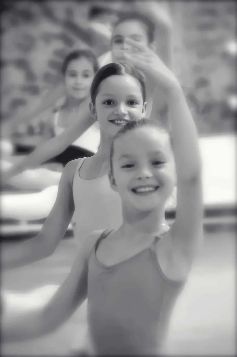 Ballet students smiling during class